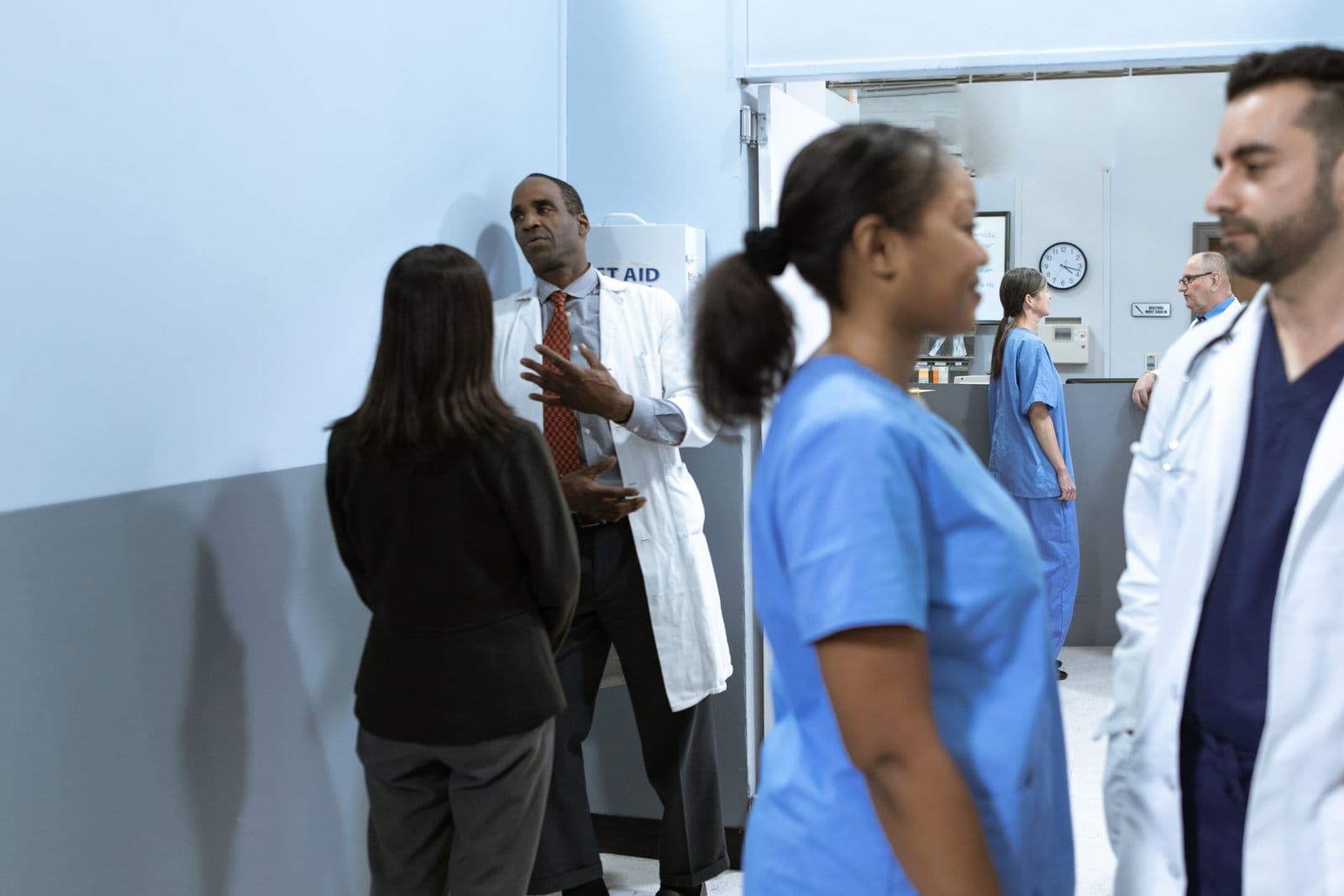 Healthcare professionals coordinating in a clinical setting